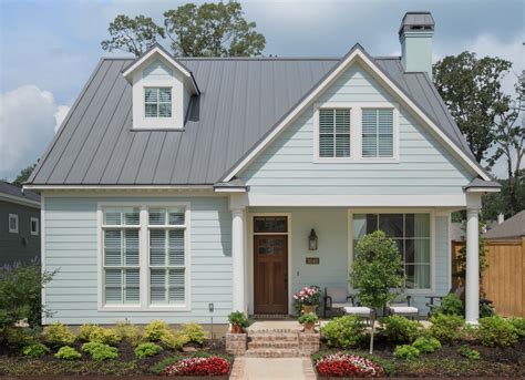 yellow house with white metal roof|yellow house with charcoal roof.